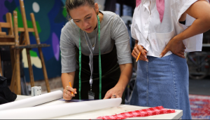 Picture of Sharon Sweeney lecturing at one of her Upcycling courses.